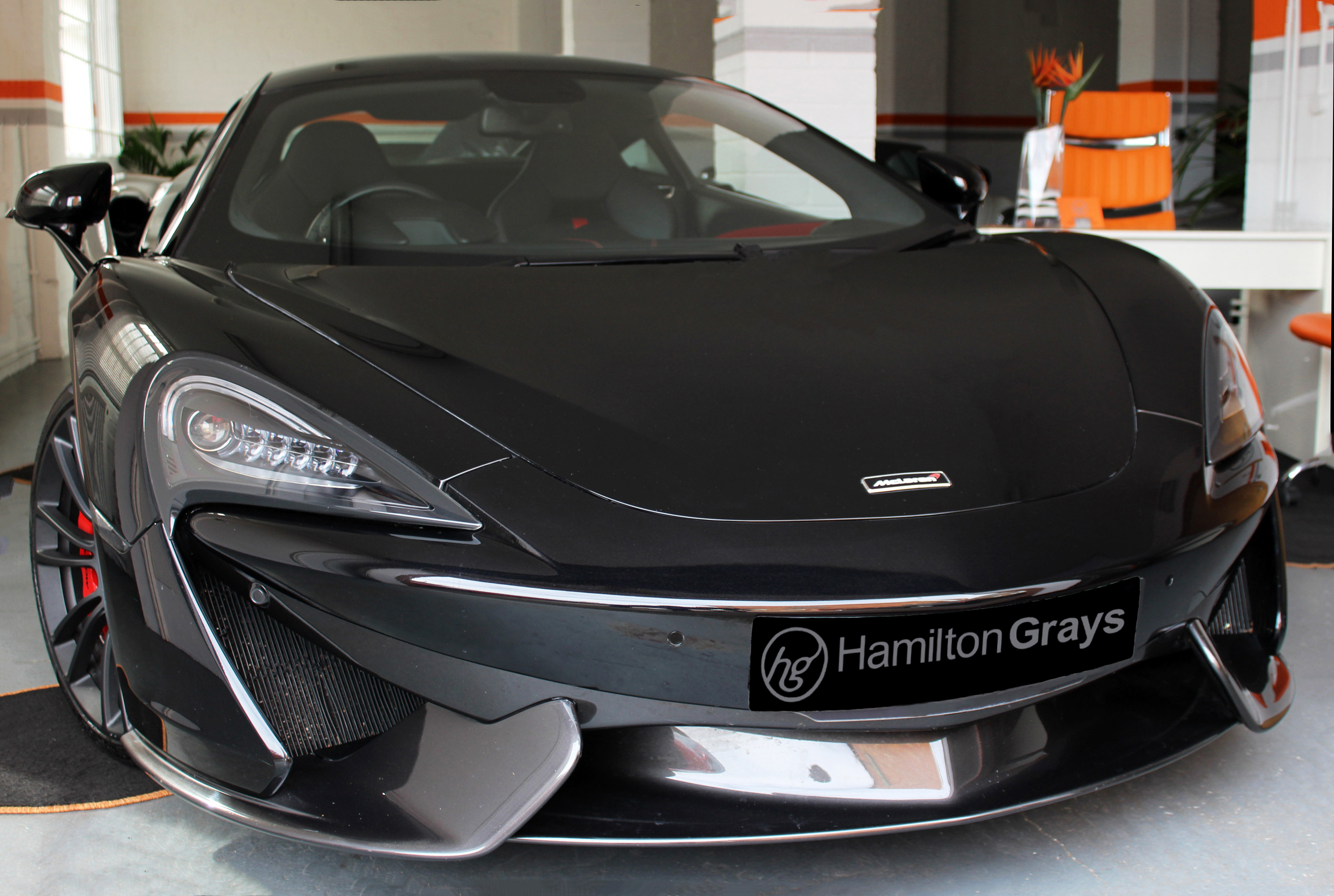2016 (16) McLaren 570S 3.8T V8 SSG. Onyx Black Metallic with Palladium Grey Interior Piped in Red. 9k.. Lift System Installed.      (SOLD)