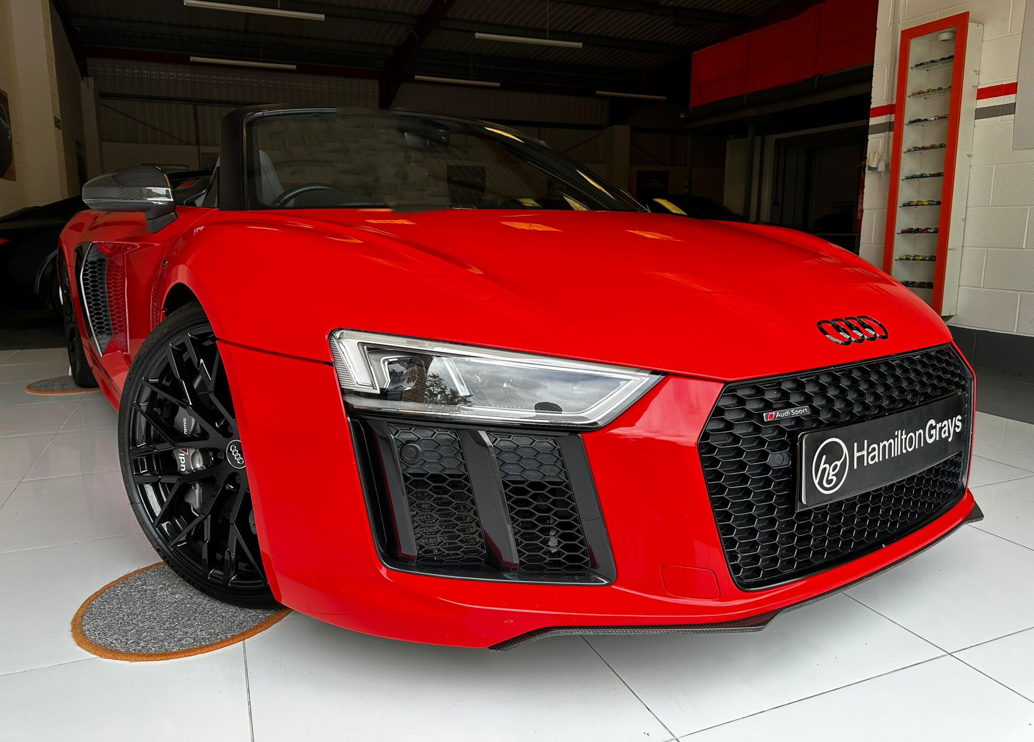 2016 (66) Audi R8 5.2 FSI V10 Spyder S Tronic quattro. In Dynamite Red with Contrasting Grey and Silver Upholstery.. Carbon Sports Seats. 32k. FASH. Ceramic Brakes, Sports Exhaust.. £82,950